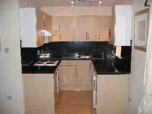 Kitchen with washing machine / fridge/freezer